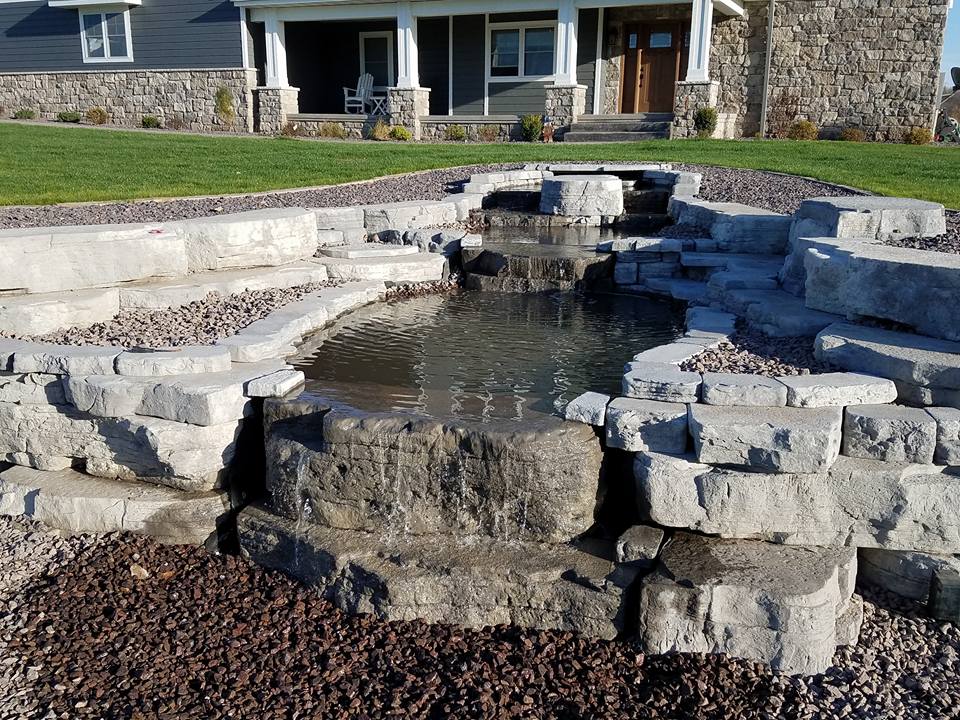 Hardscaped Waterfall and pond in backyard